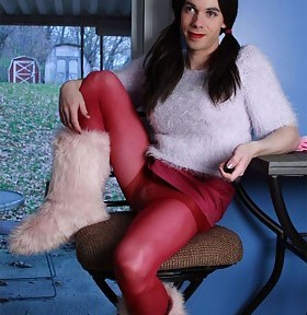 Trans in fuzzy boots plus a big purple toy